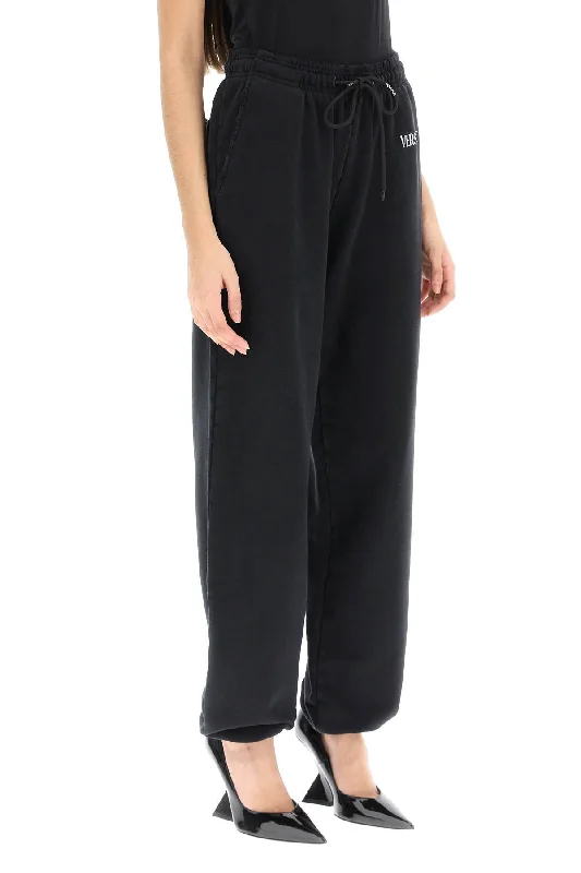 Relaxed fit pants for laid-back comfort wear -distressed jogger pants with logo embroidery